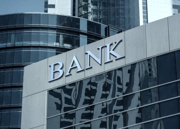 bank sign on glass wall of business center